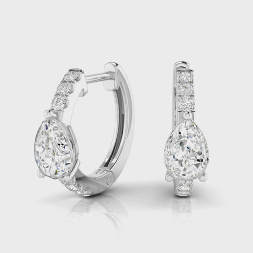 14 Karat Lab Grown Huggy Earrings with a Pear-Shape Center (.70 Total Carat Weight F Color VS Clarity)