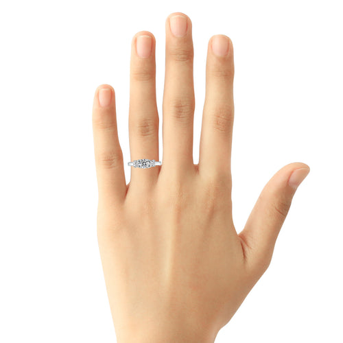 Three-stone diamond ring in 14k white gold on hand