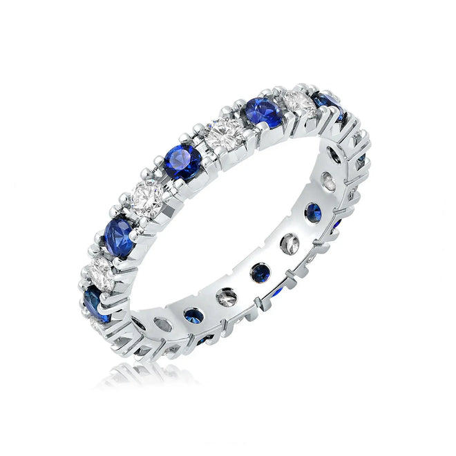 Classic four prong diamond and sapphire wedding band