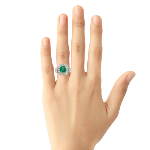 Rectangular emerald and diamond ring in 18k two-tone gold on hand
