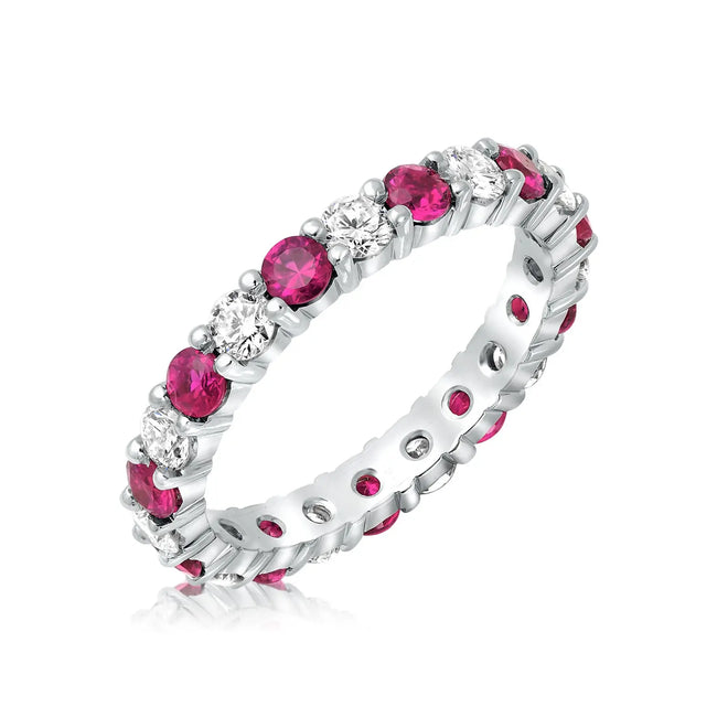Shared prong diamond and pink sapphire wedding band in 14 karat