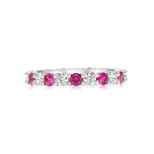 Shared prong diamond and pink sapphire wedding band in 14 karat