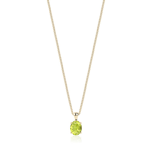Oval concave cut peridot pendant set in 14 karat