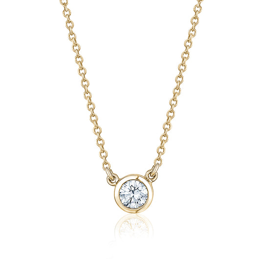 Rich, warm 18k yellow gold diamond bezel set pendant