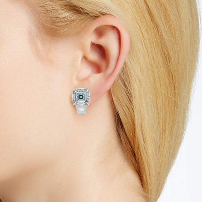 Diamond and aquamarine earrings in 18k white gold on ear