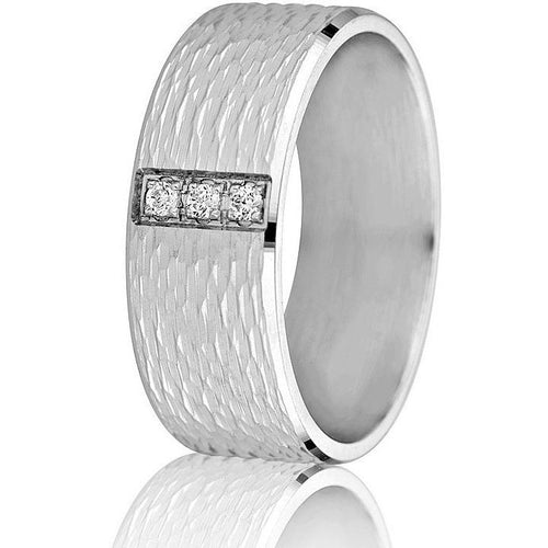 Wide 8 mm comfort-fit wedding band with textured engraving and shiny bevelled edges set with 3 round brilliant cut diamonds in white gold.