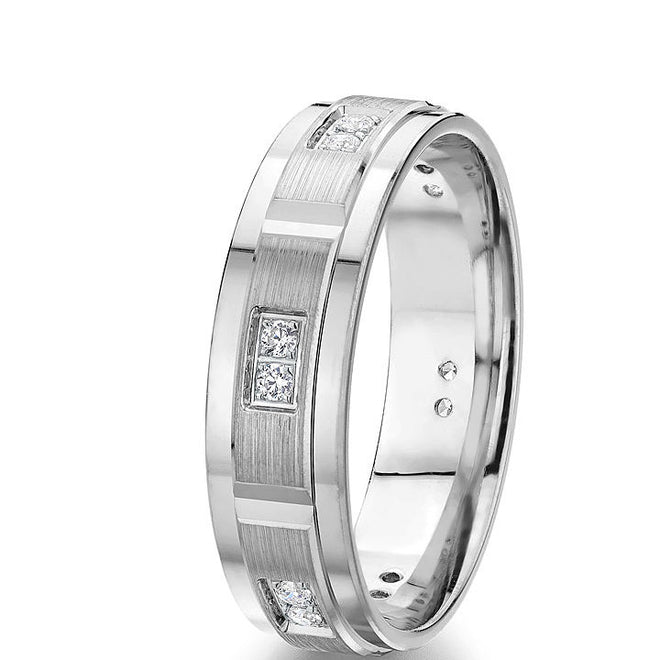 Modern 6 mm comfort-fit engraved diamond wedding band with bold rectangular diamond sections in 10k white gold with 12 round natural brilliants, 0.18 cts, total weight.