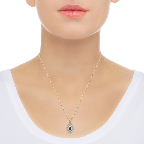 Diamond and oval sapphire pendant necklace on neck
