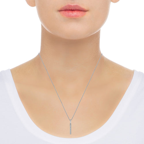 Vertical diamond bar necklace in 14k white gold on neck