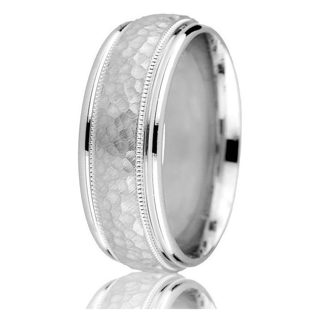 Striking domed 8 m.m.band featuring a hammered finish centre,milgrain detail with rounded edges in 14k white gold.