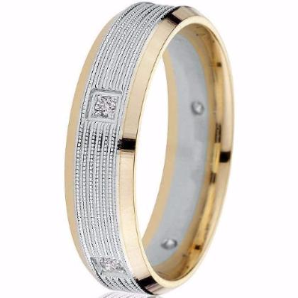 A two-tone yellow and white gold engraved wedding band ring with diamond inlays and a milgrain detail.