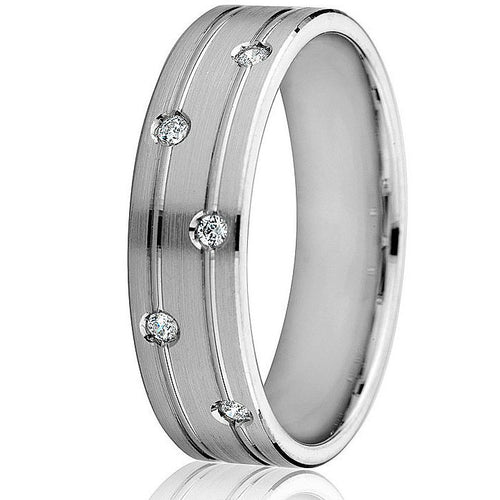 A 6mm width 14k white gold wedding ring with diamonds set on the top half, featuring bright engraved lines and a satin finish.